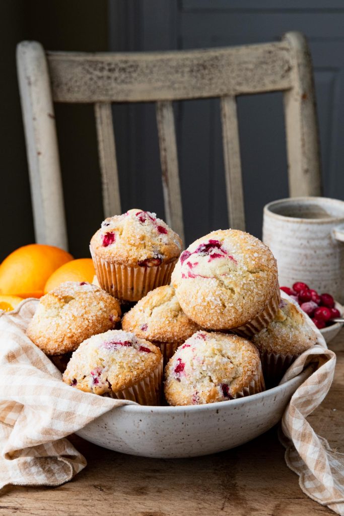 Side shot of a bowl of easy cranberry orange muffins