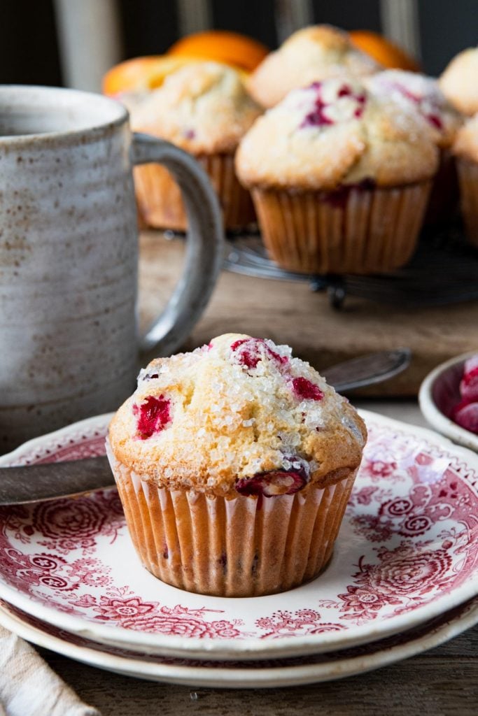 Cranberry orange muffin on a red and white plate