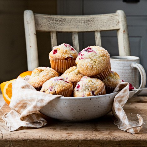 Square side shot of a bowl of easy cranberry orange muffins