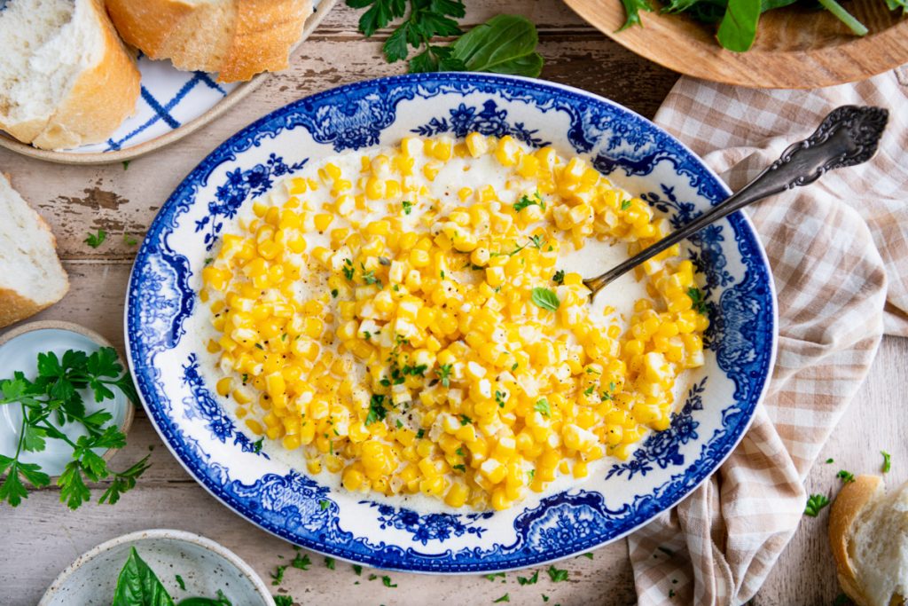 Horizontal shot of a bowl of southern creamed corn