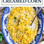 Bowl of crock pot creamed corn with text title box at top