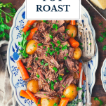 Platter of crock pot pot roast with text title overlay