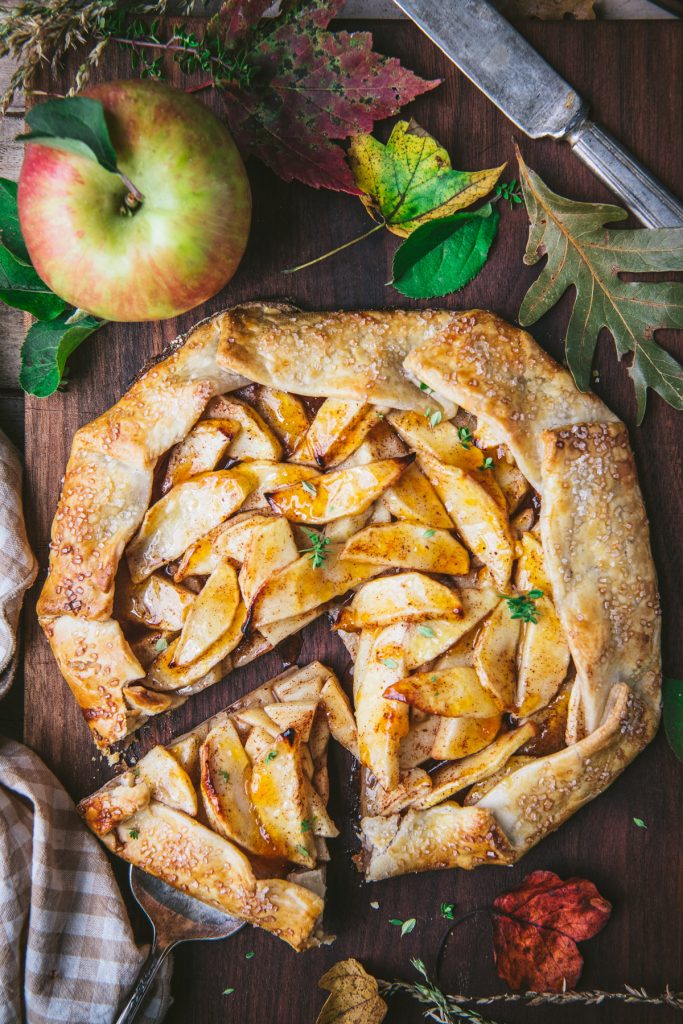 Overhead shot of an apple galette on a wooden table