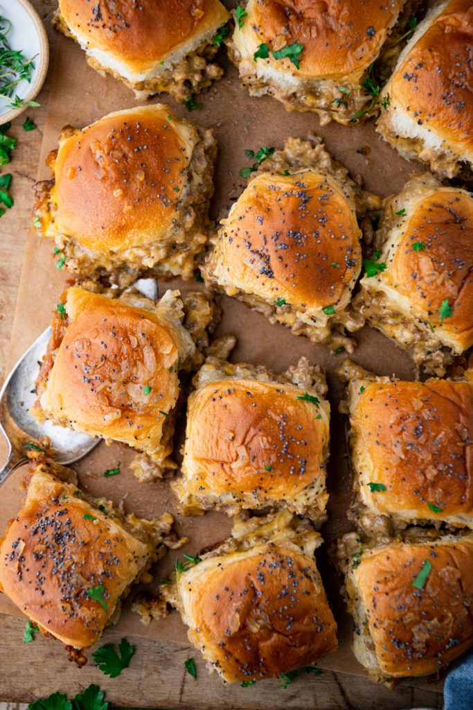 Pull apart hanky panky ground beef and sausage sliders on a wooden board