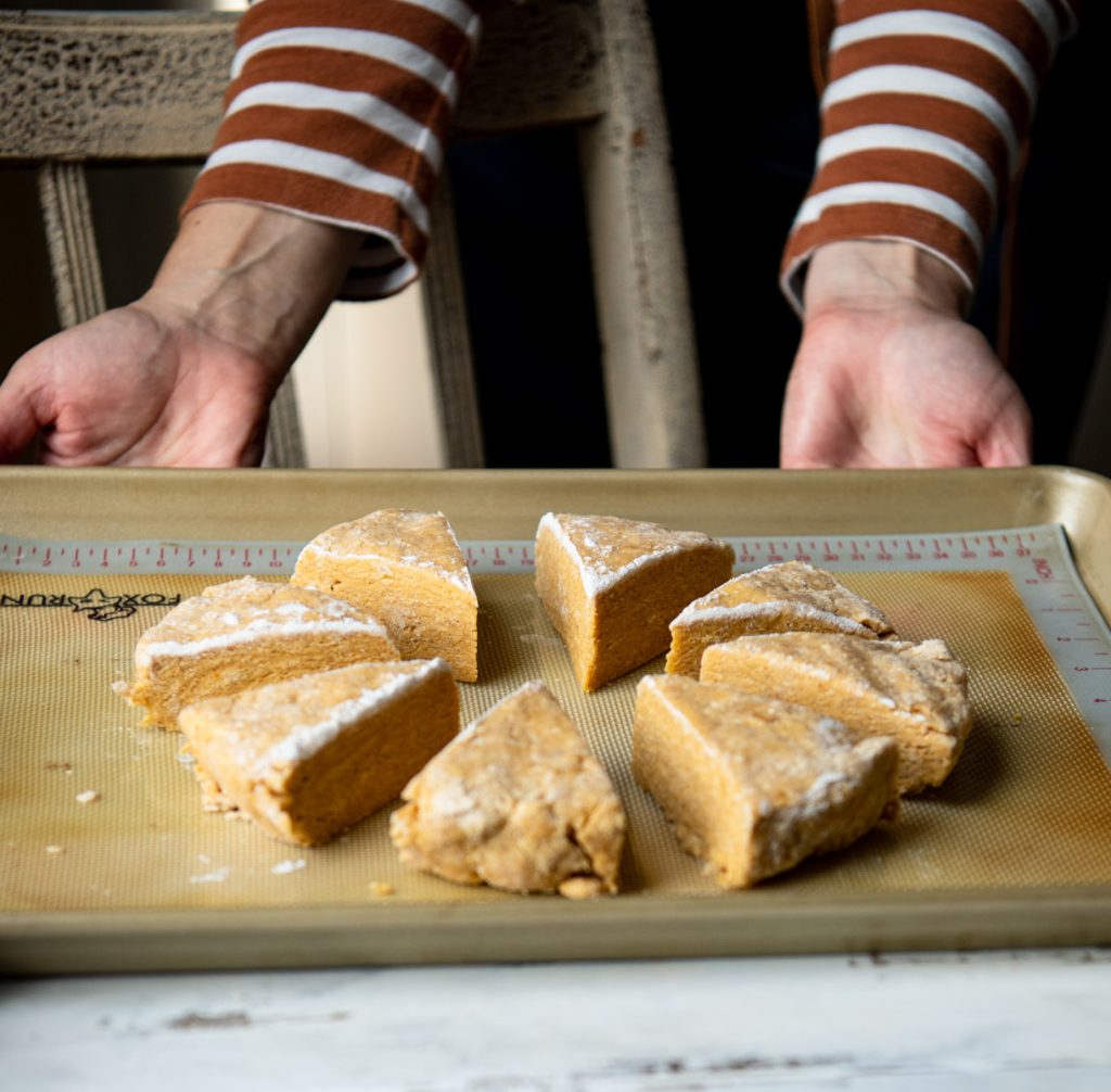 Pumpkin scones on baking sheet before oven