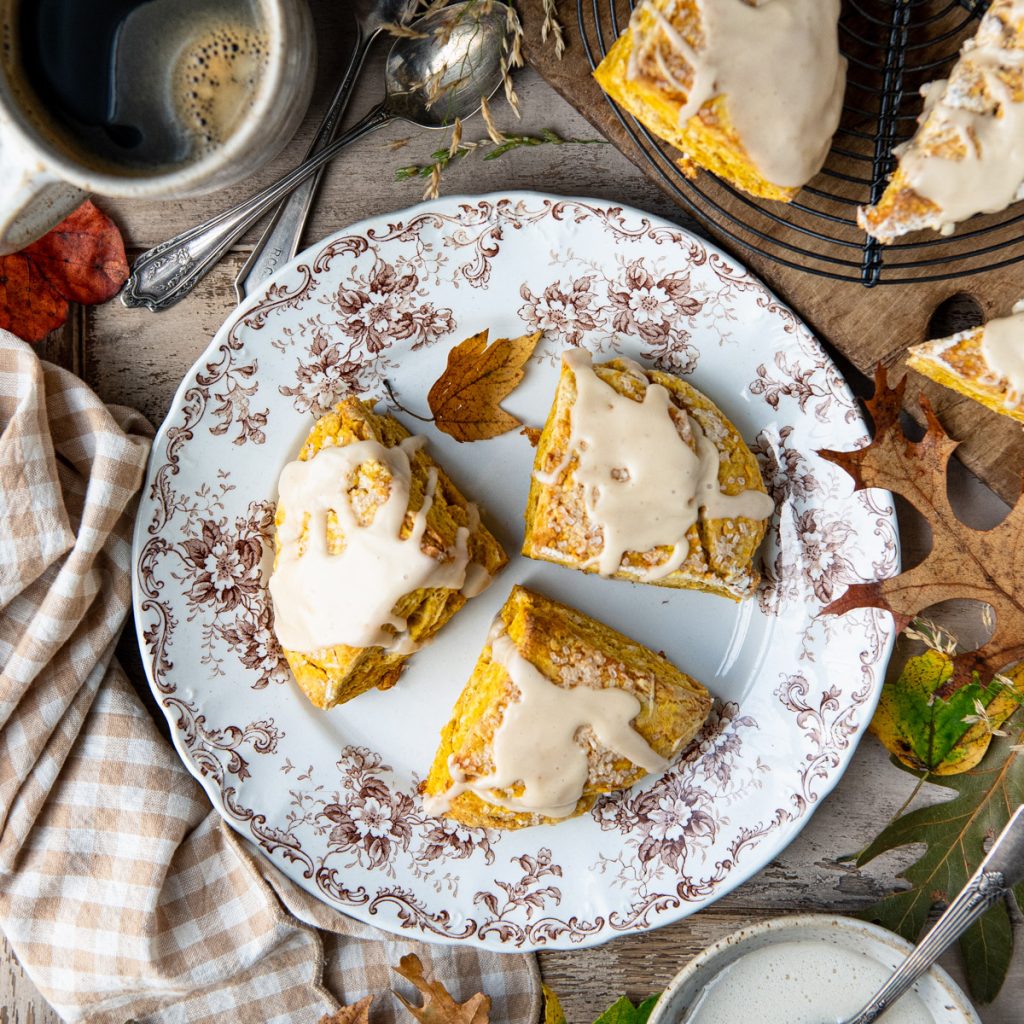 Square overhead shot of a plate of pumpkin scones