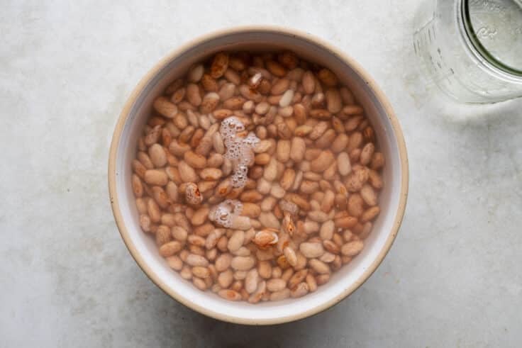 Soaking pinto beans in water.