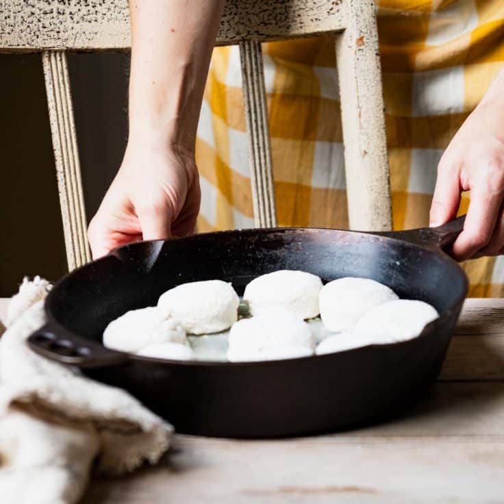 Bisquick 7up biscuits in a cast iron skillet before baking.