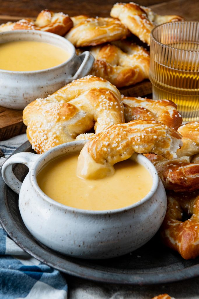 Bowl of beer cheese pretzel dip on a table