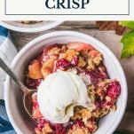 Bowl of apple cranberry crisp with text title box at top