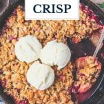 Skillet of cranberry apple crisp with text title overlay