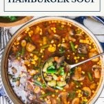 Pot of hamburger vegetable soup with text title box at top