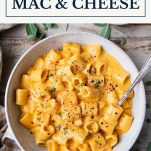 Bowl of pumpkin mac and cheese with text title box at top