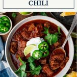 Texas chili in a bowl with text title box at top