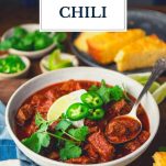 Front shot of a bowl of texas chili with text title overlay