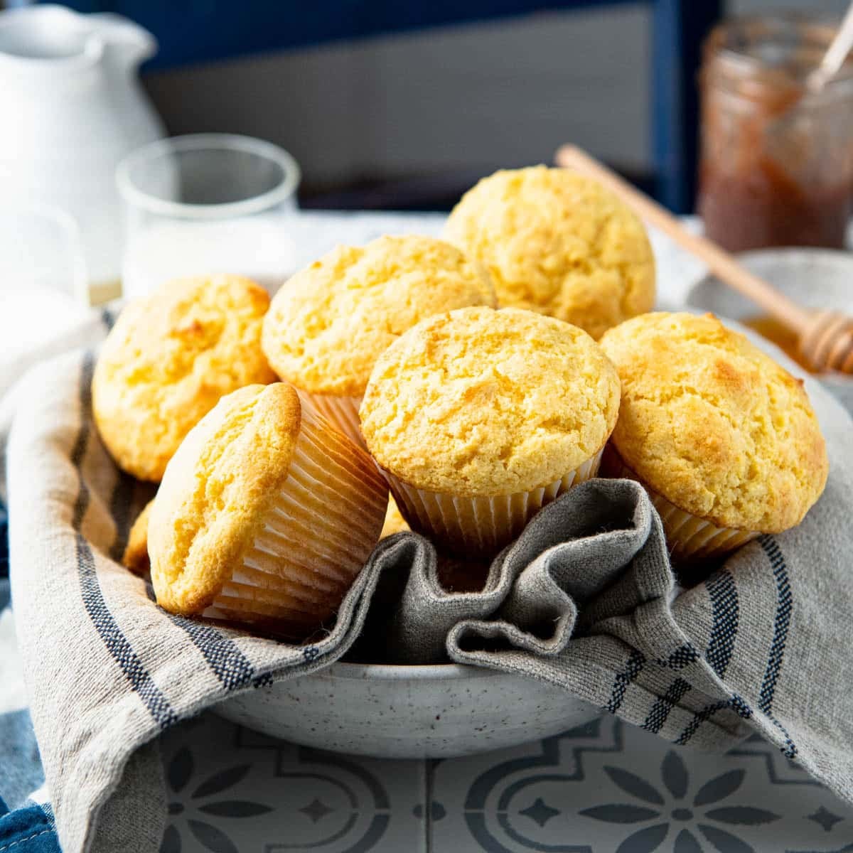 Square side shot of a bowl of cornbread muffins.