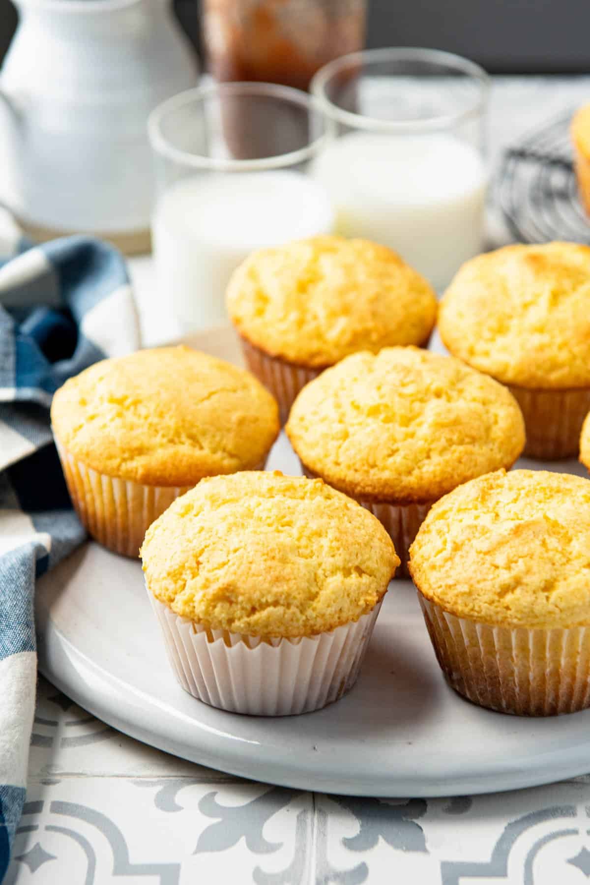 White platter full of homemade cornbread muffins.