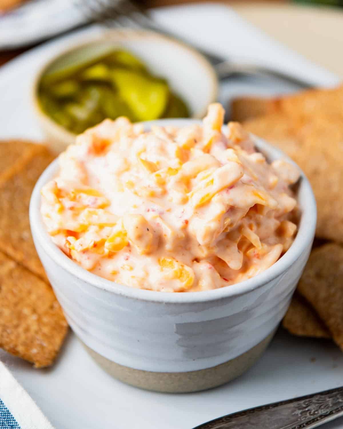 Side shot of a simple pimento cheese recipe in a white bowl.