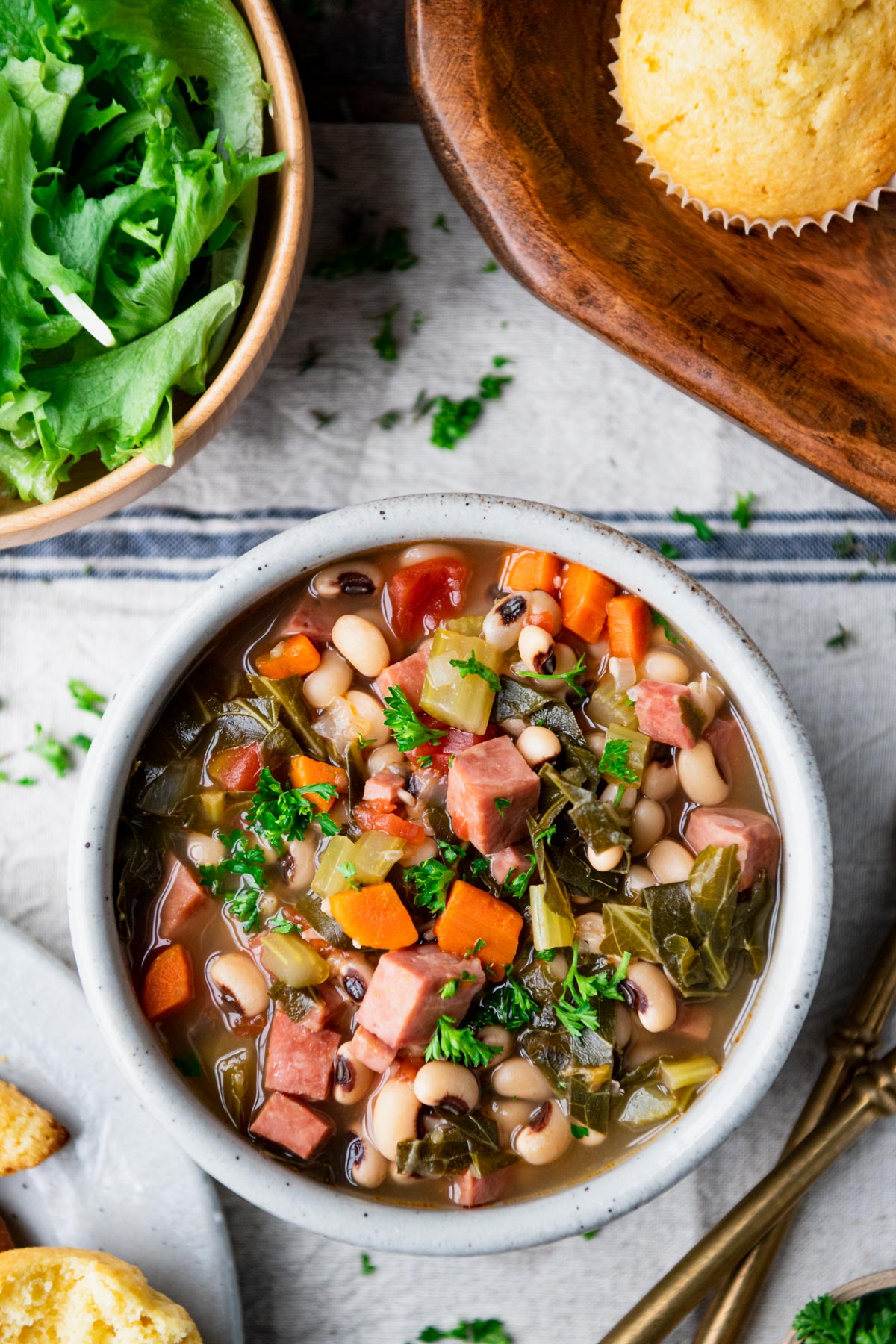 Southern black eyed pea soup in a gray bowl on a dinner table