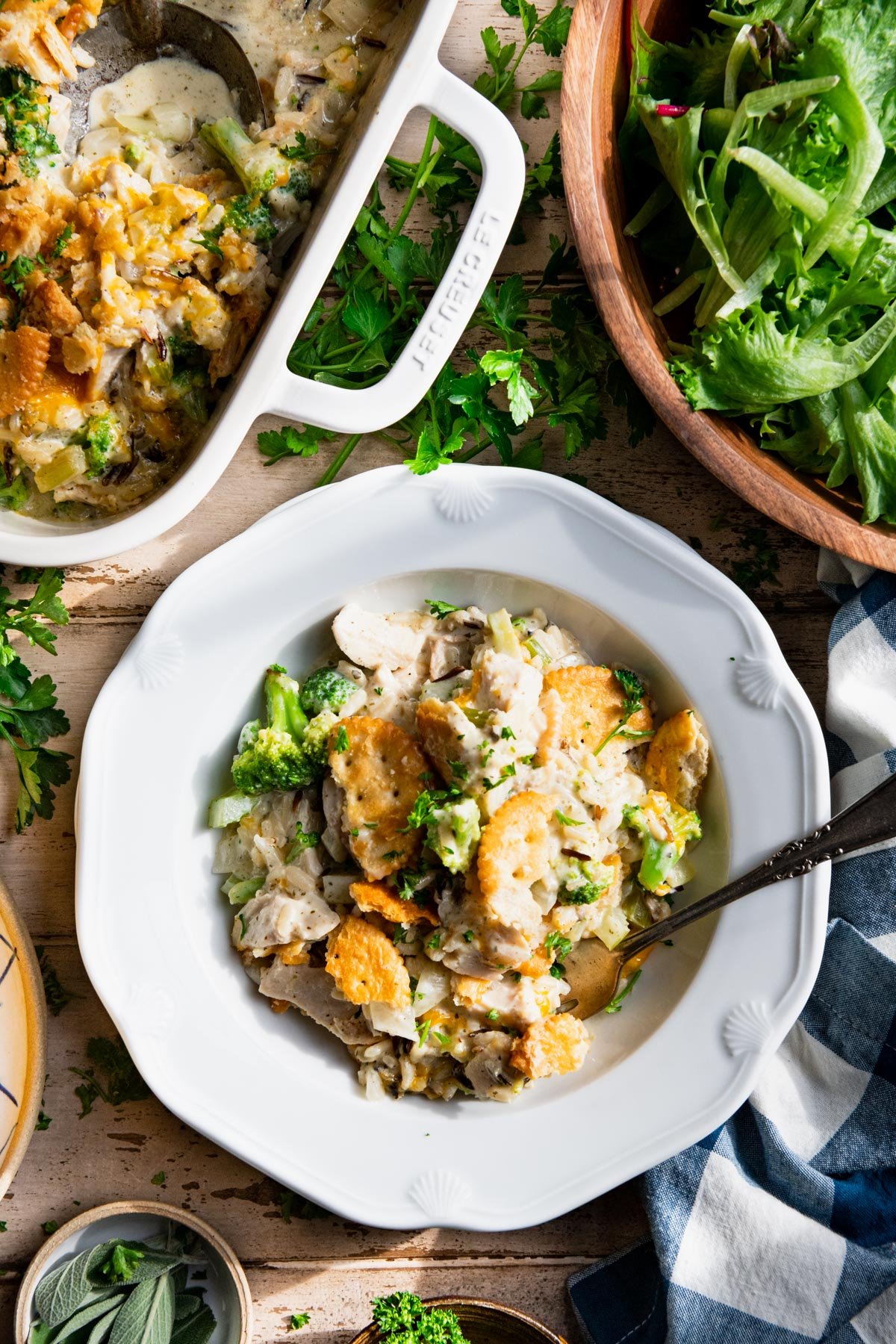 Overhead image of chicken and wild rice casserole in a white bowl on a table