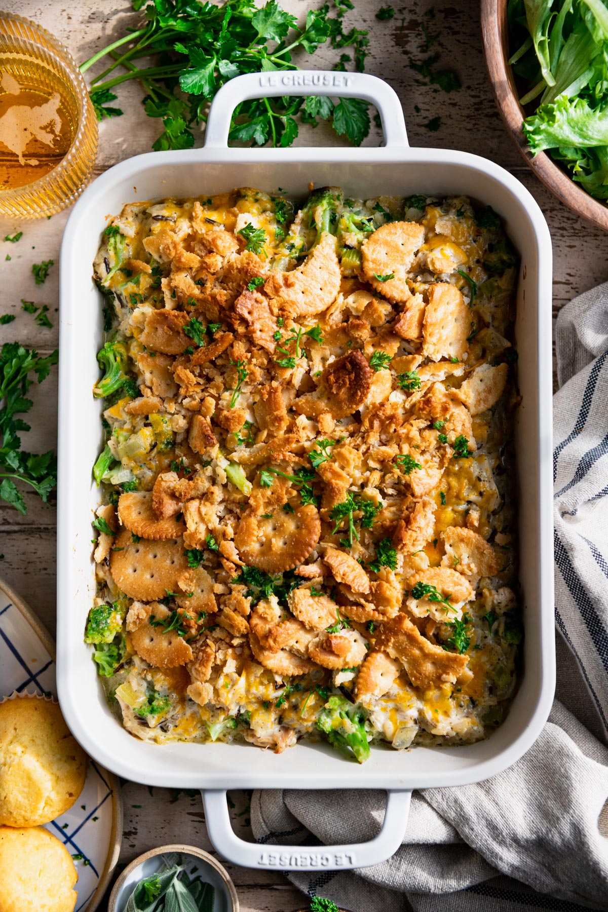 Overhead image of easy chicken and wild rice casserole with broccoli on a dinner table