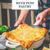 Hands holding a pan of chicken pot pie with puff pastry with text title overlay