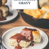 Buttermilk biscuit on a plate with chocolate gravy and text title overlay
