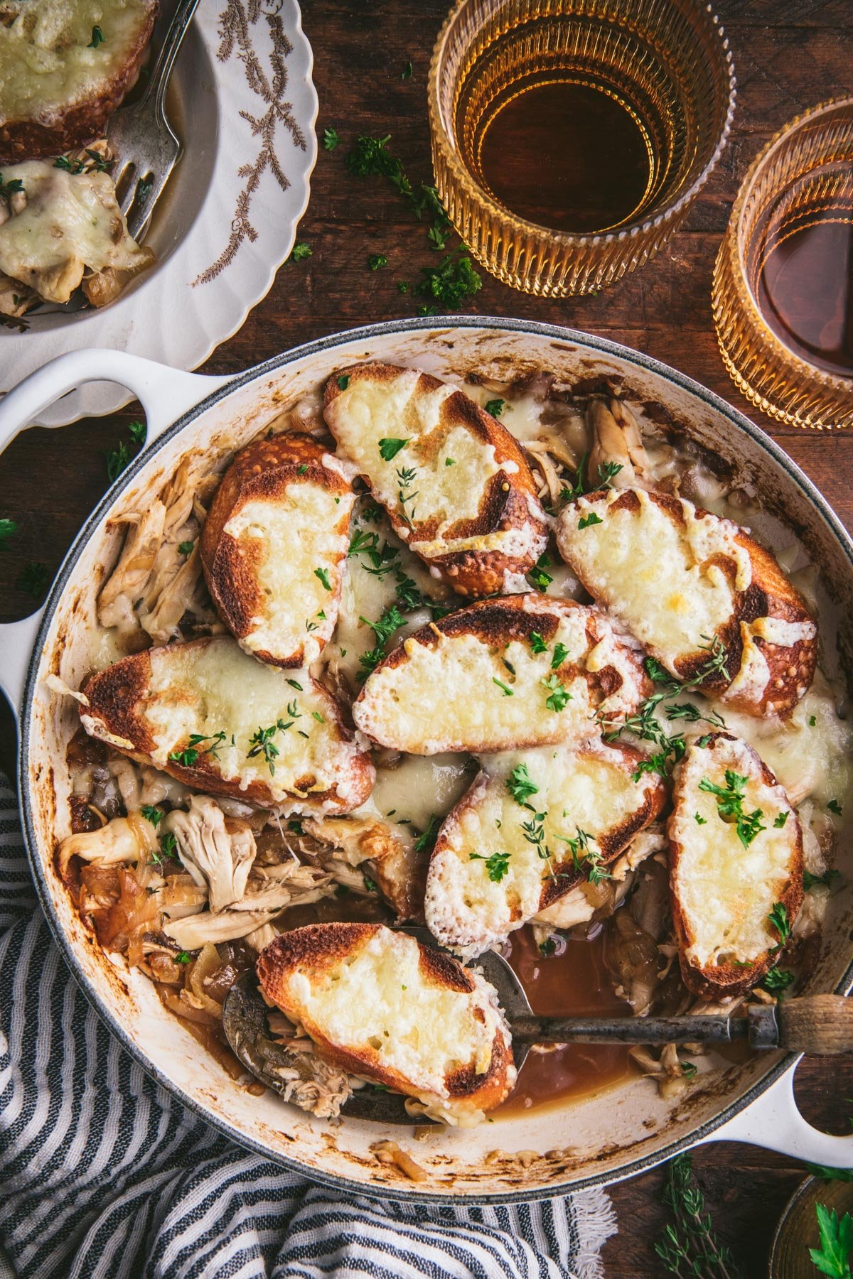 Overhead image of a skillet of French onion chicken bake