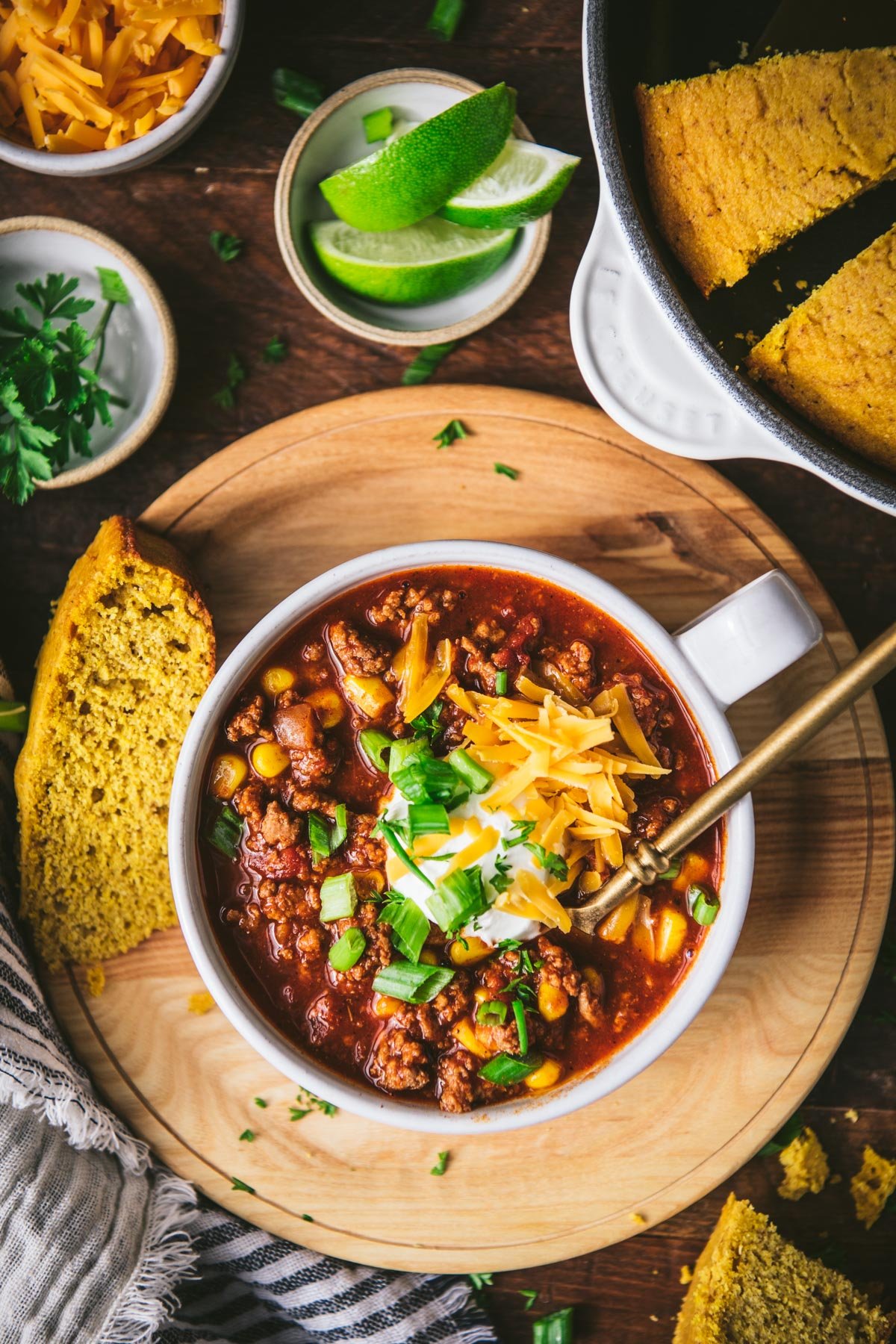 Easy turkey chili recipe served in a white bowl with a side of cornbread