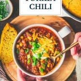 Hands eating a bowl of ground turkey chili with text title overlay