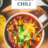 Overhead shot of ground turkey chili in a bowl with text title overlay