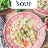 Hands eating a bowl of ham and potato soup with text title overlay
