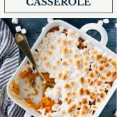 Dish of sweet potato casserole with marshmallows and text title box at top