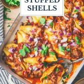 Close overhead image of taco stuffed shells with text title overlay