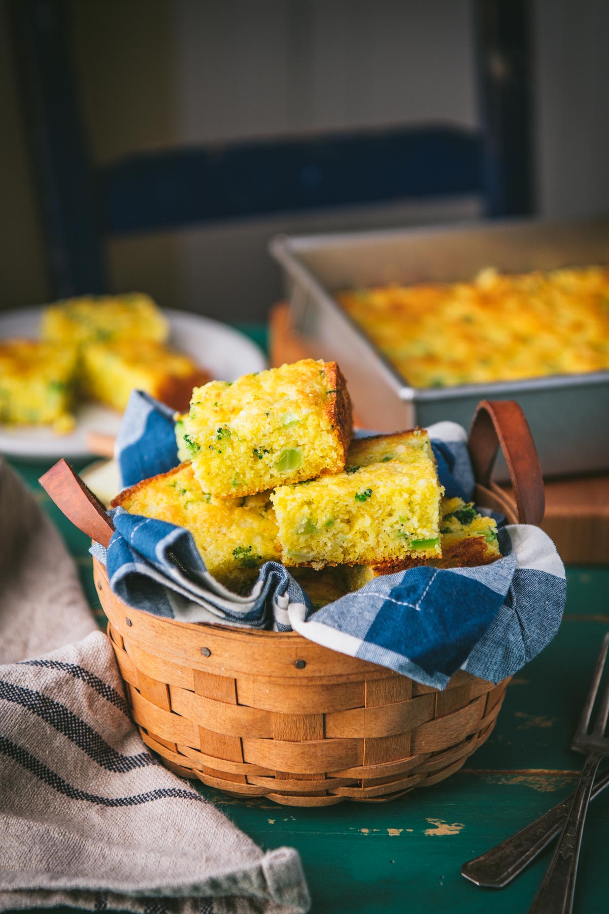 Jiffy cornbread with broccoli in a basket on a table