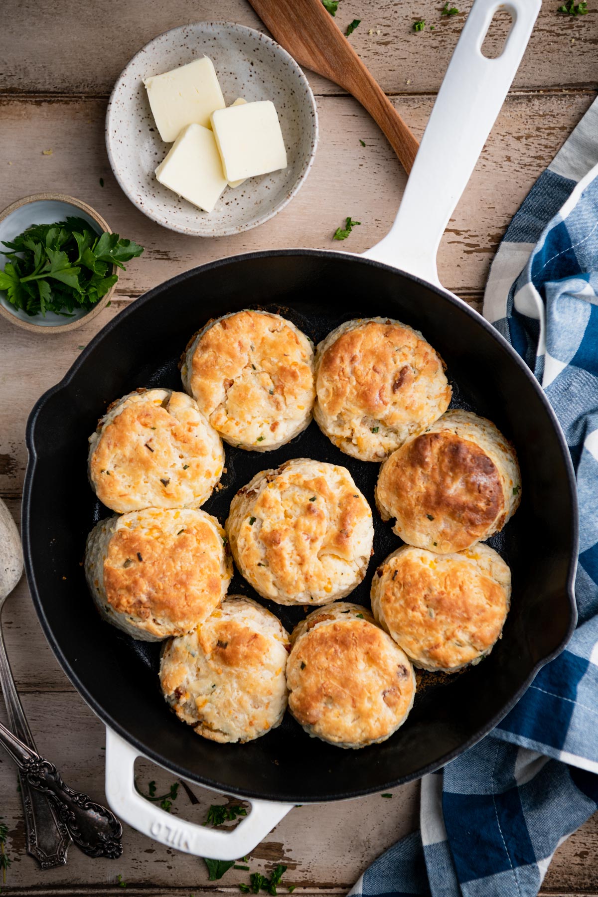 Overhead shot of cheddar biscuits in a cast iron skillet