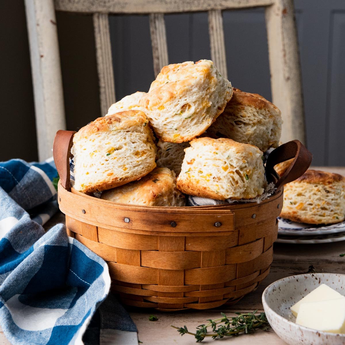 Square side shot of cheddar biscuits in a basket
