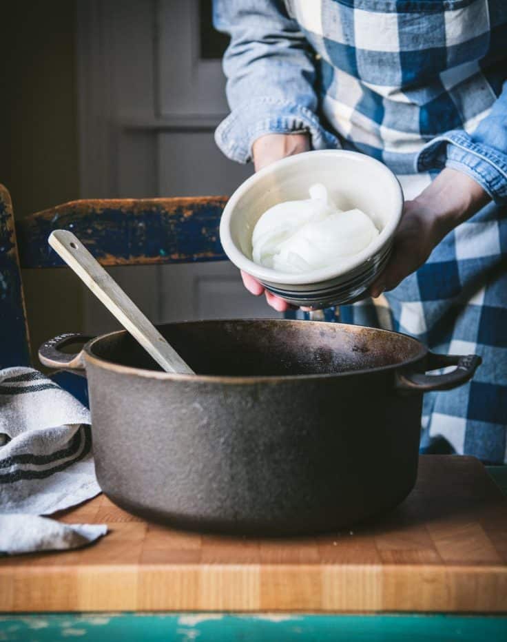 Adding onion to a pot