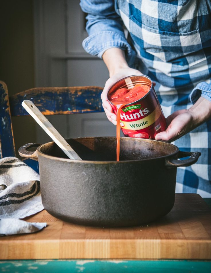 Process shot showing how to make collard greens with bacon