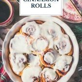 The best cinnamon roll recipe ever in a white pan with text title overlay