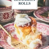 Christmas cinnamon rolls on a plate with text title overlay