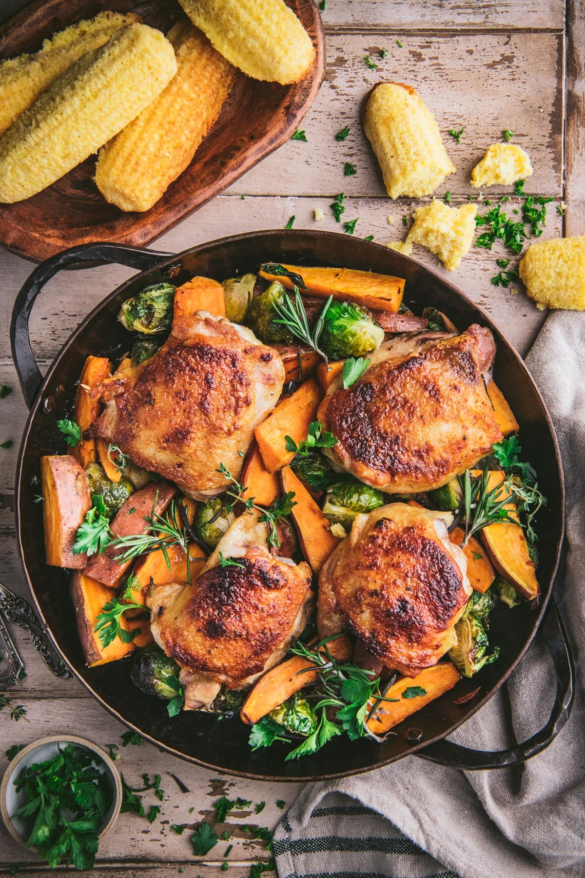 Overhead image of crispy roasted chicken thighs in a cast iron skillet