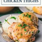 Plate of roasted chicken thighs with text title box at top.