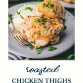 Roasted chicken thighs on a plate with text title at bottom.