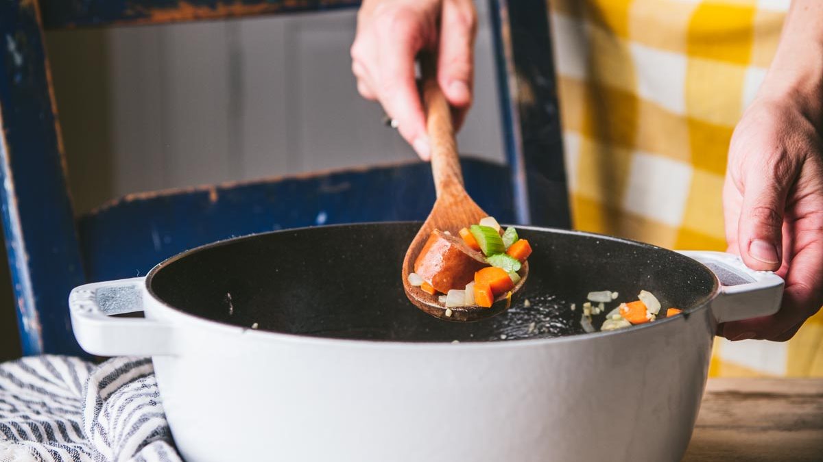 Sauteing vegetables and sausage in pot