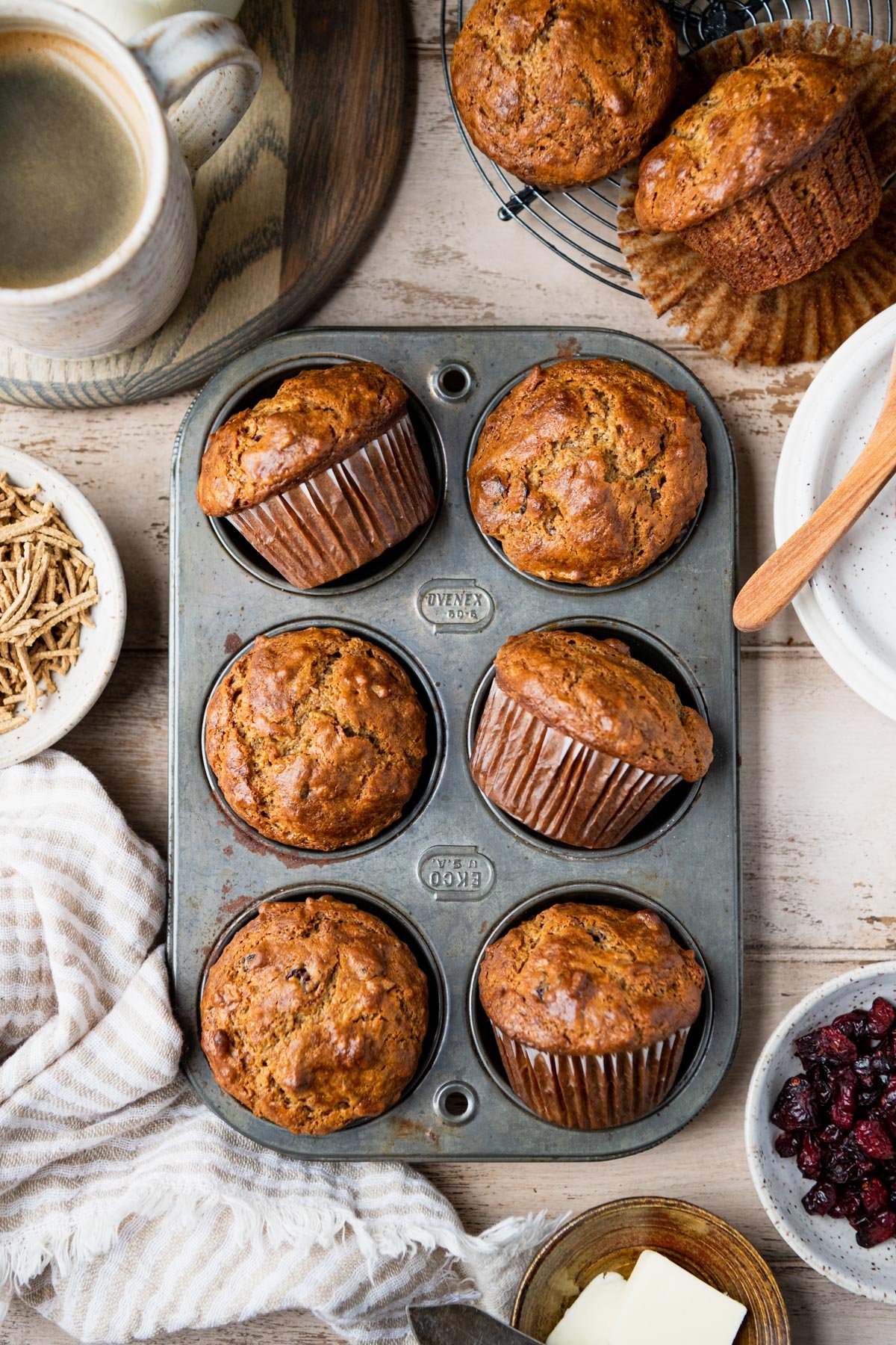 Overhead shot of old fashioned bran muffins in a vintage muffin tin