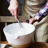 Whisking dry ingredients in a large bowl