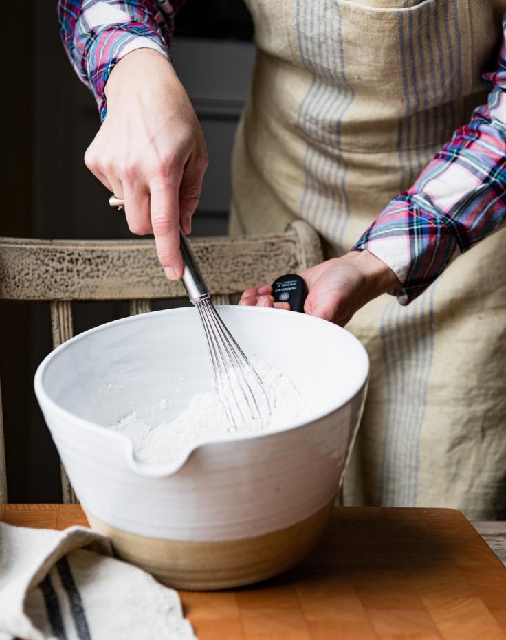 Whisking dry ingredients in a large bowl