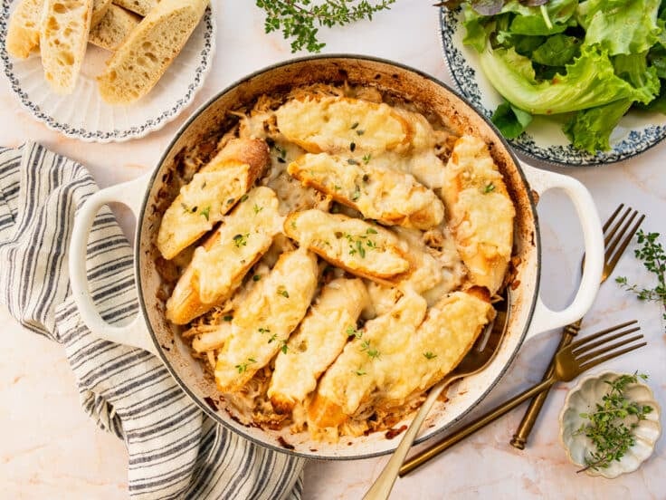 Horizontal overhead image of a pan of French onion chicken casserole.