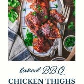 Tray of baked bbq chicken thighs with text title at the bottom.